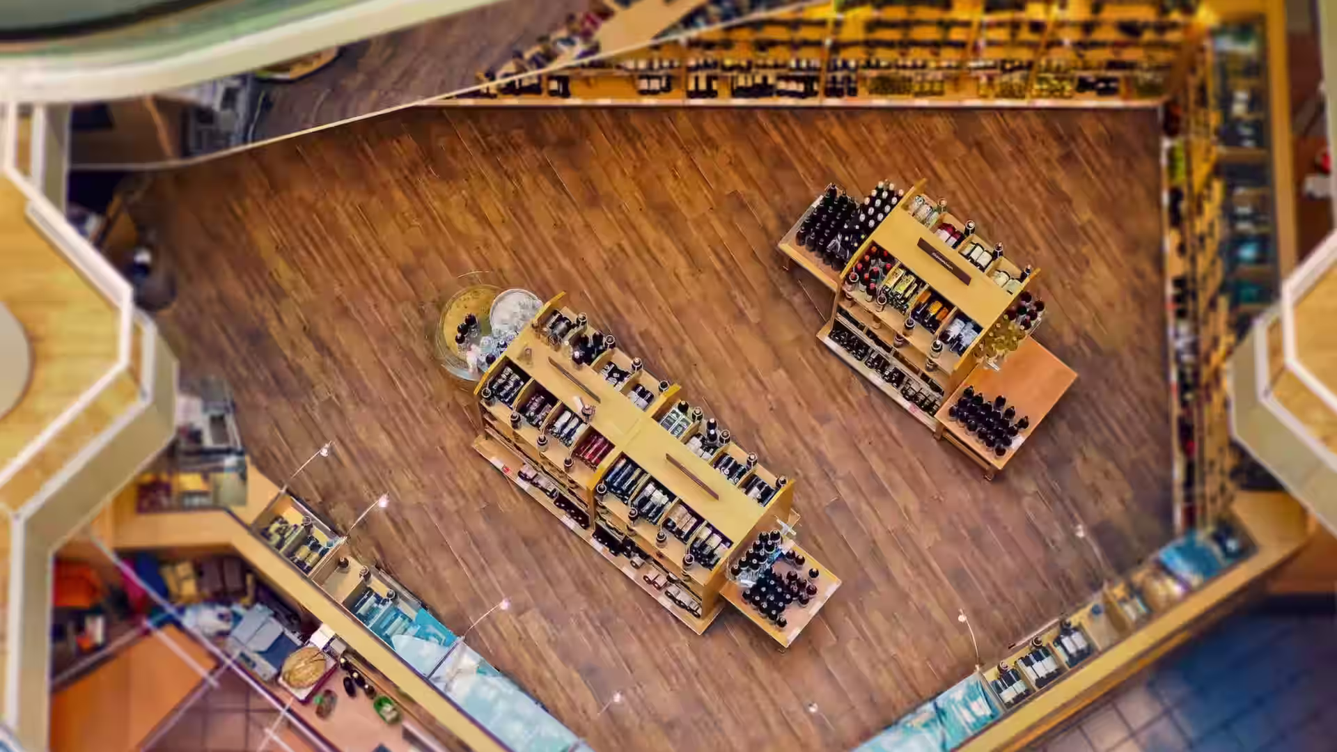 An overhead view of shoppers and shelving in a retail store