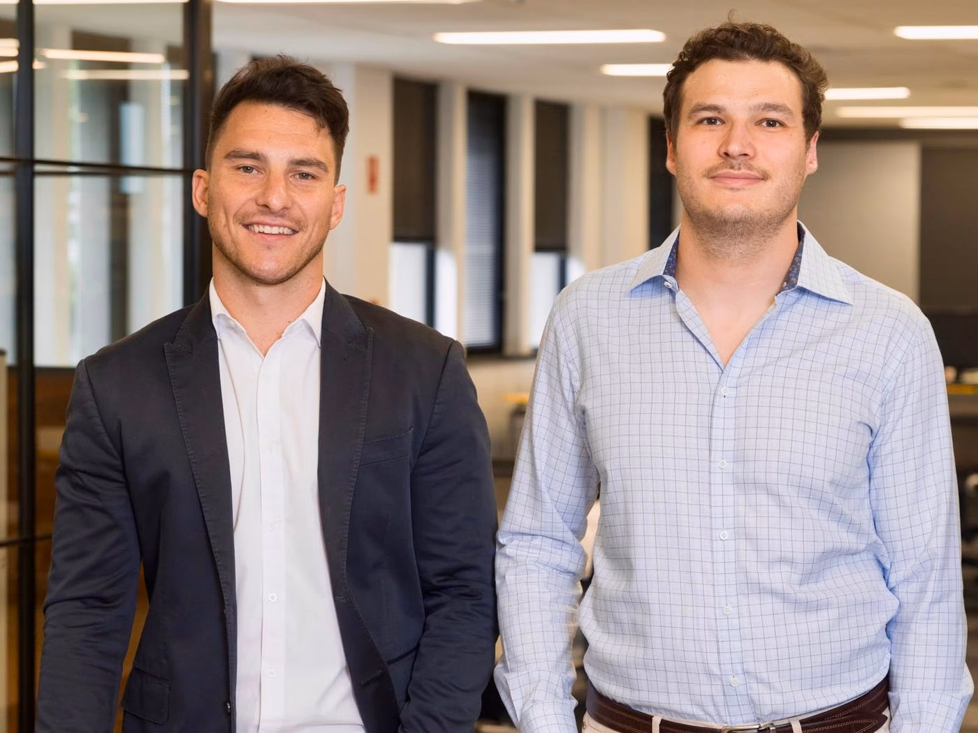 Tiliter co-founders Christopher Sampson and Marcel Herz standing in the Tiliter office