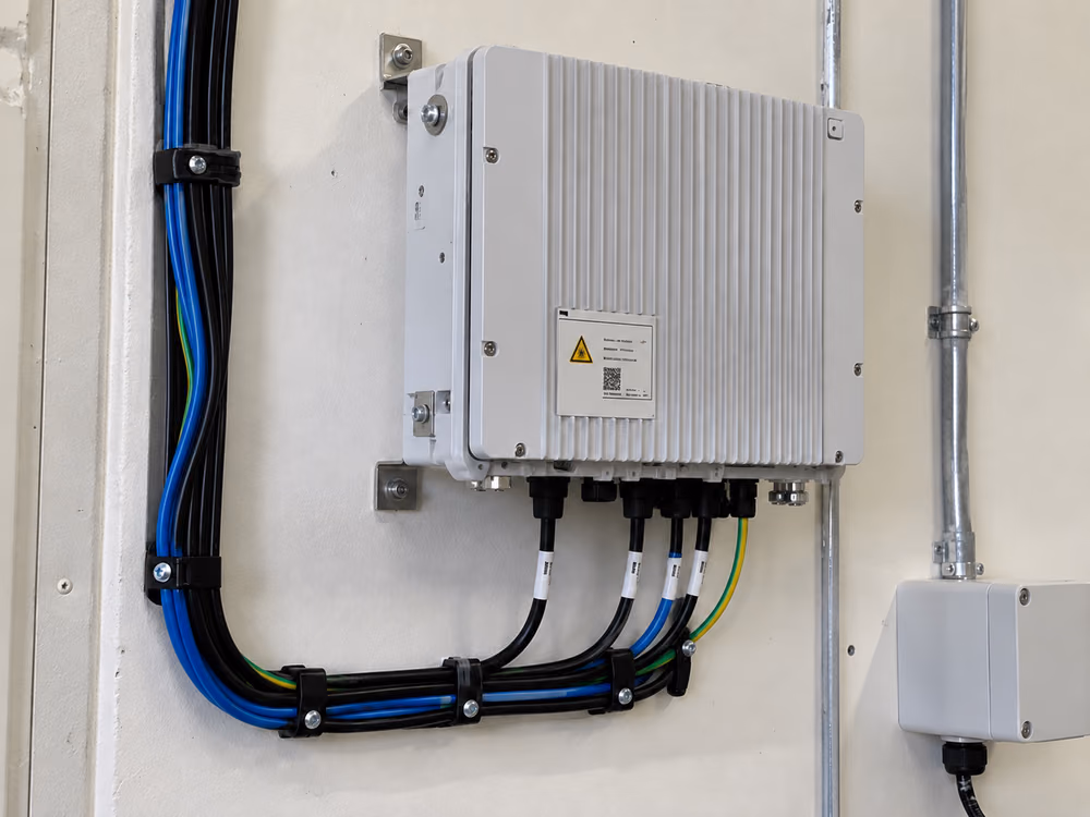 The same unit with two clips missing from the vertical cable run