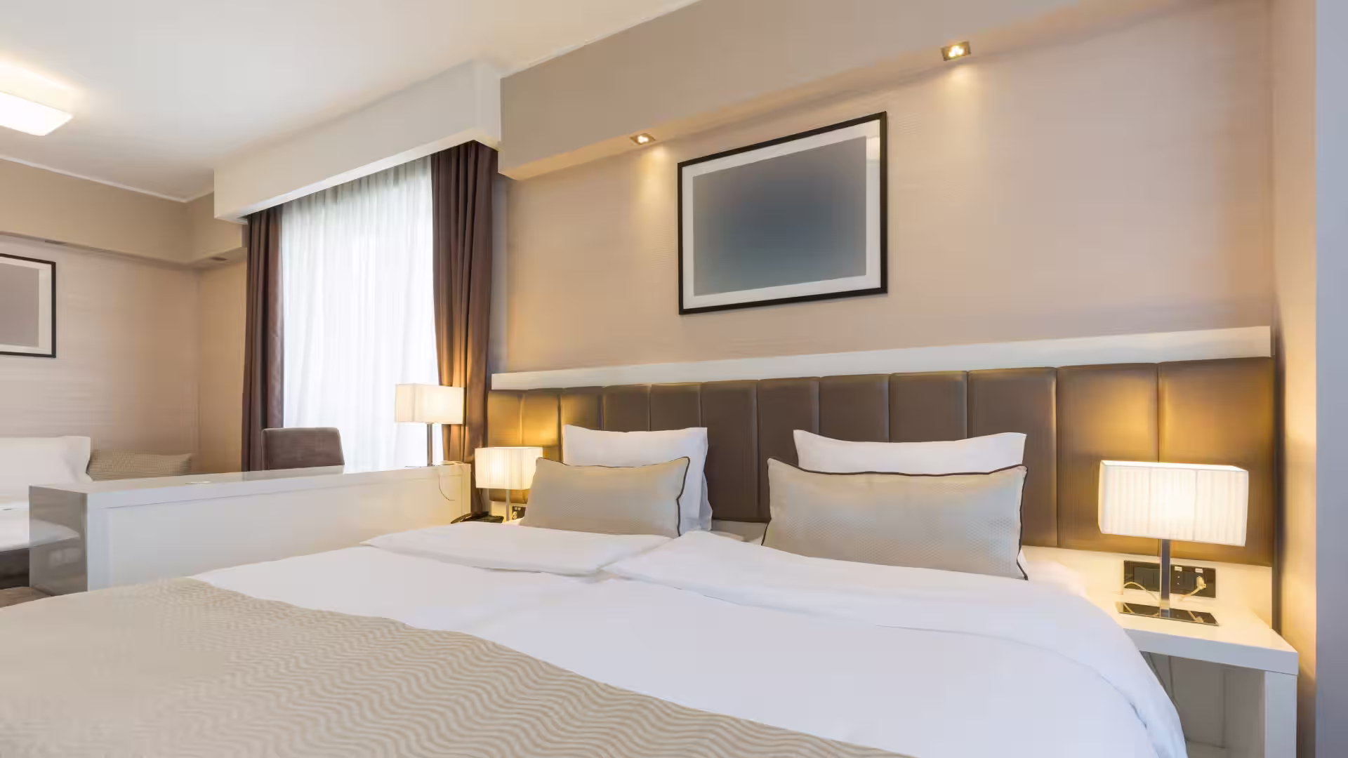 A hotel bedroom prepared and ready for a guest